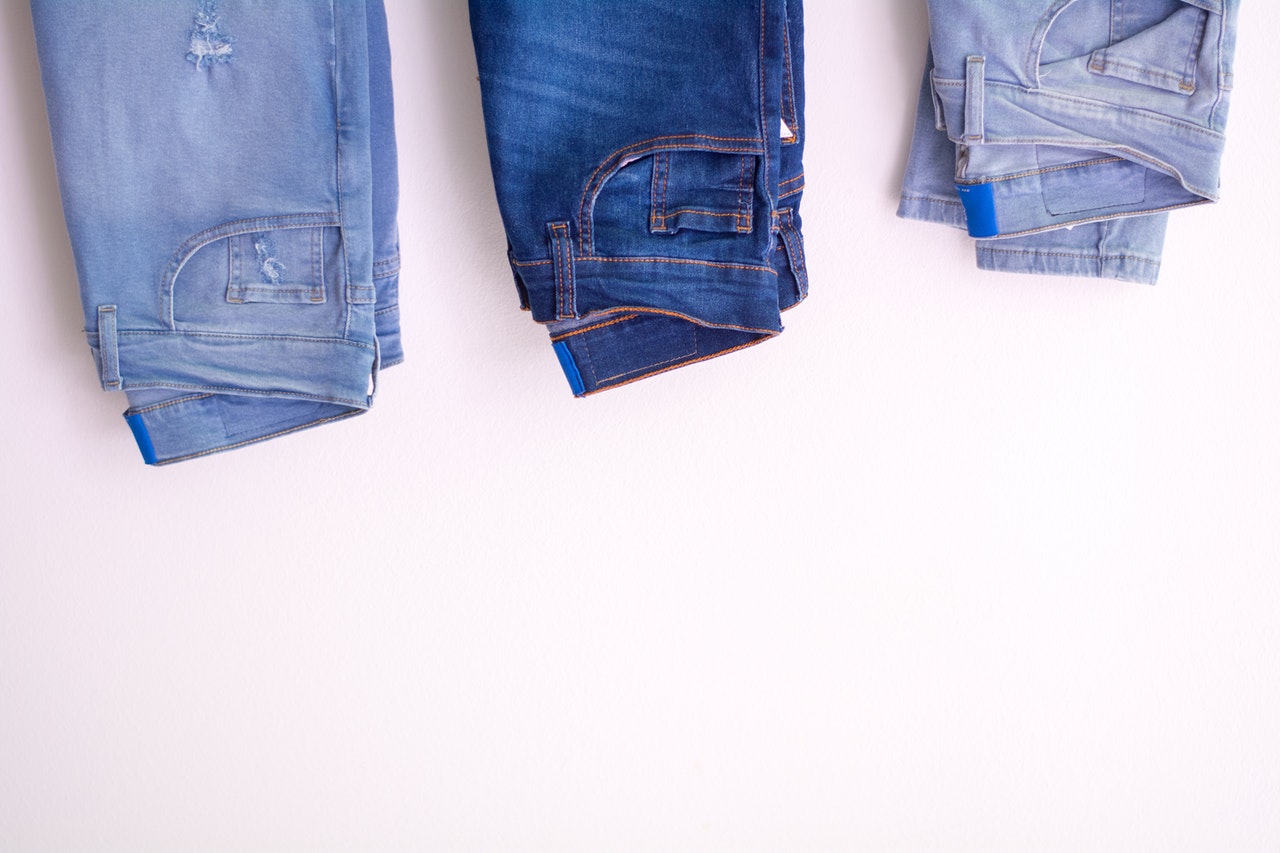 Three pair of jeans on white background