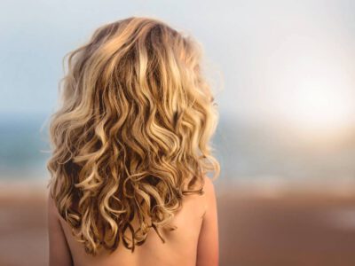 Woman with blond curly hair